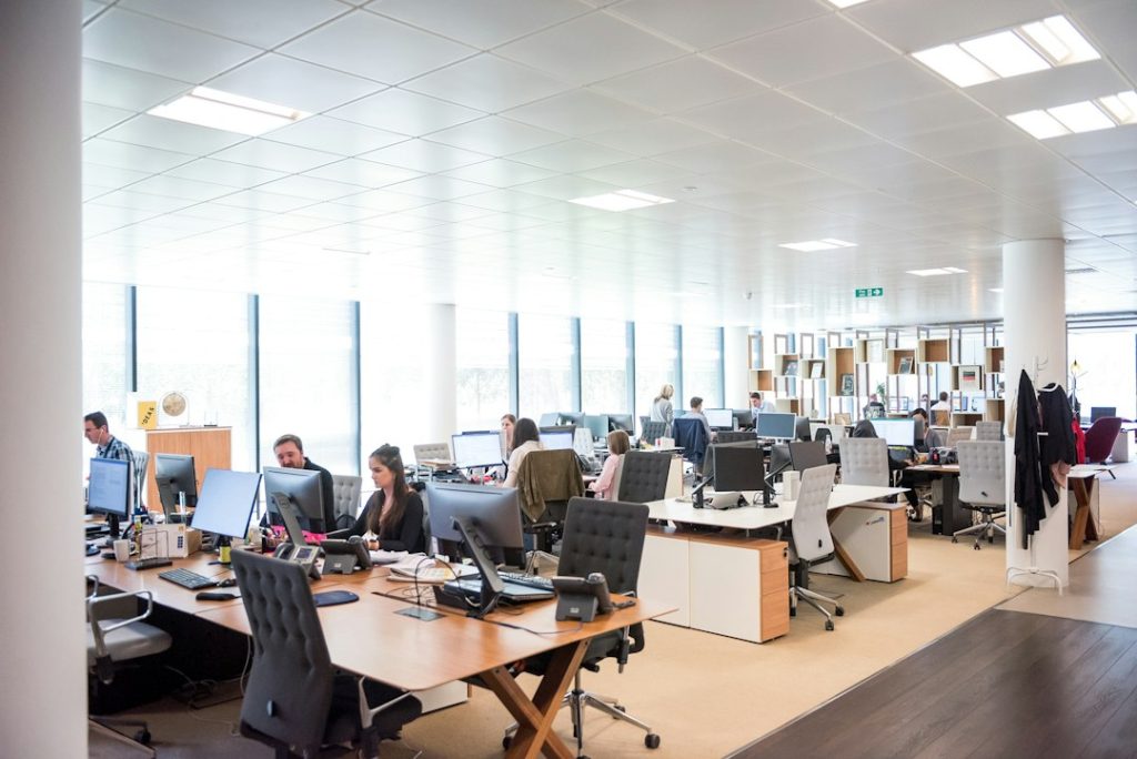 People working at desks in a professional customer support office